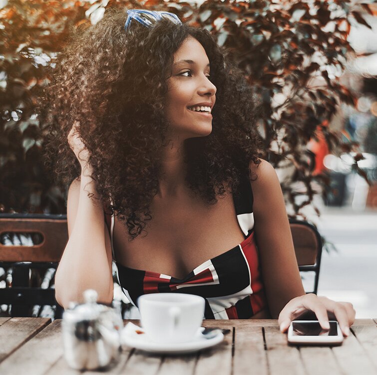 Philadelphia breast surgery model having a cup of coffee outside