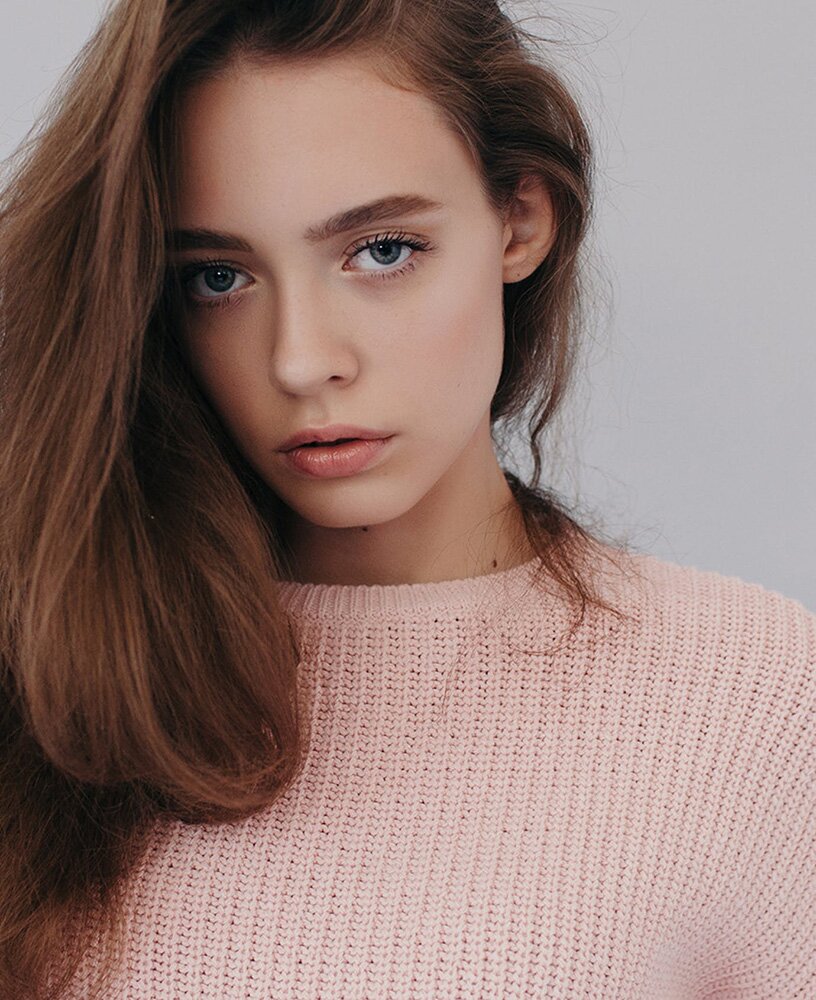 Philadelphia Botox model in a pink sweater